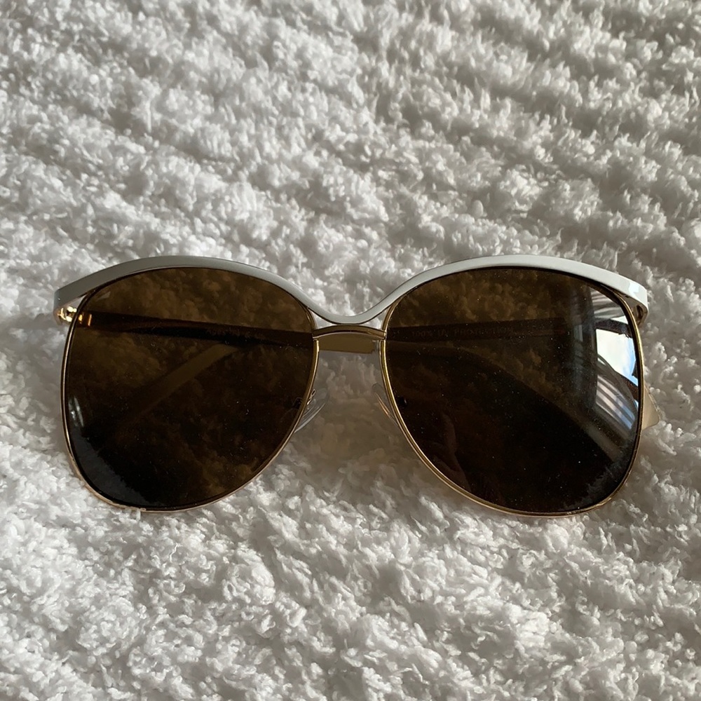 Gold and white framed sunglasses